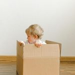 Little Boy Inside A Box